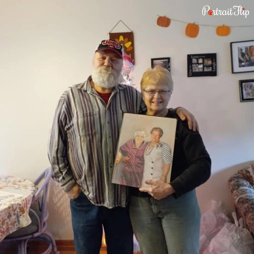 old couple with handmade portrait