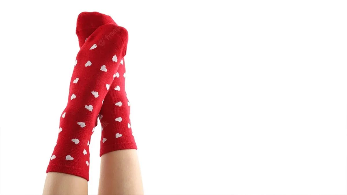 Red heart socks with a white background as a gift for valentine's day