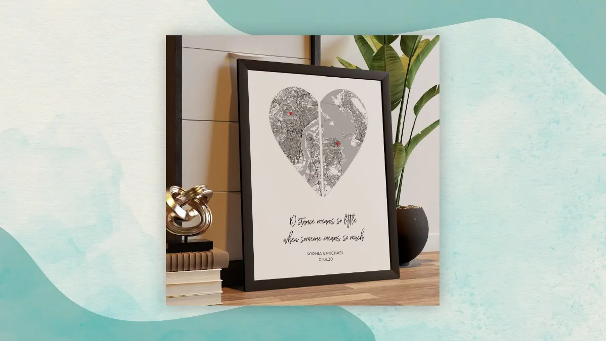 A heart shaped map on a white background and a wooden frame kept on a wooden shelf as prefect gifts for long distance relationships. 