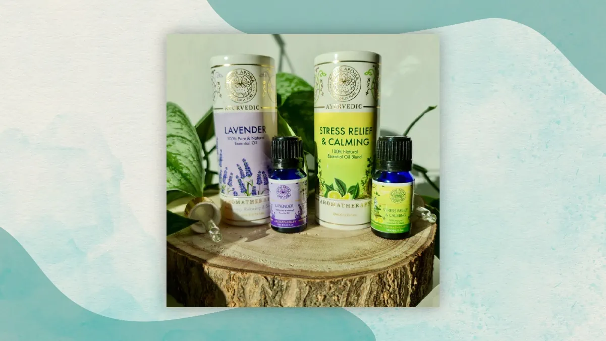 Two big and two small bottles of lavender, stress relief and calming essential oils kept on a flat wooden top as gifts for long distance relationships. .  