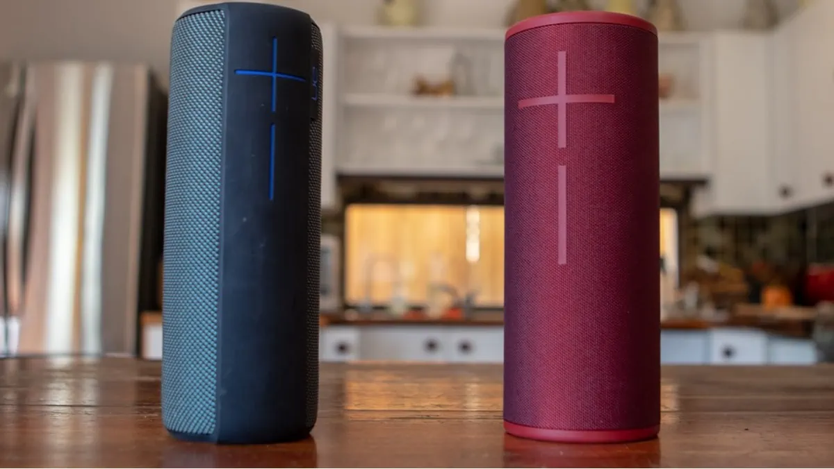 Two awesome Bluetooth speakers are placed on the brown background. 