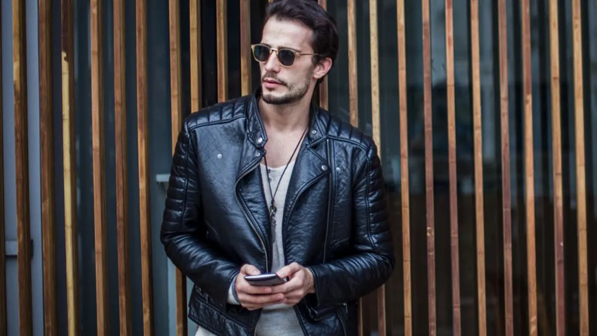 A middle age handsome hunk donned a leather jacket from H&M 