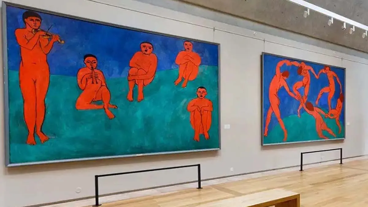 Music and Dance painting placed next to each other on wall in a museum