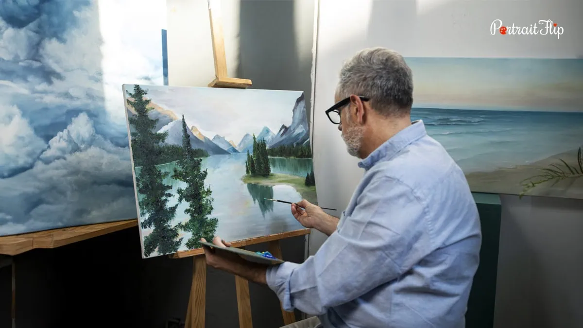 a middle aged man painting on a canvas 