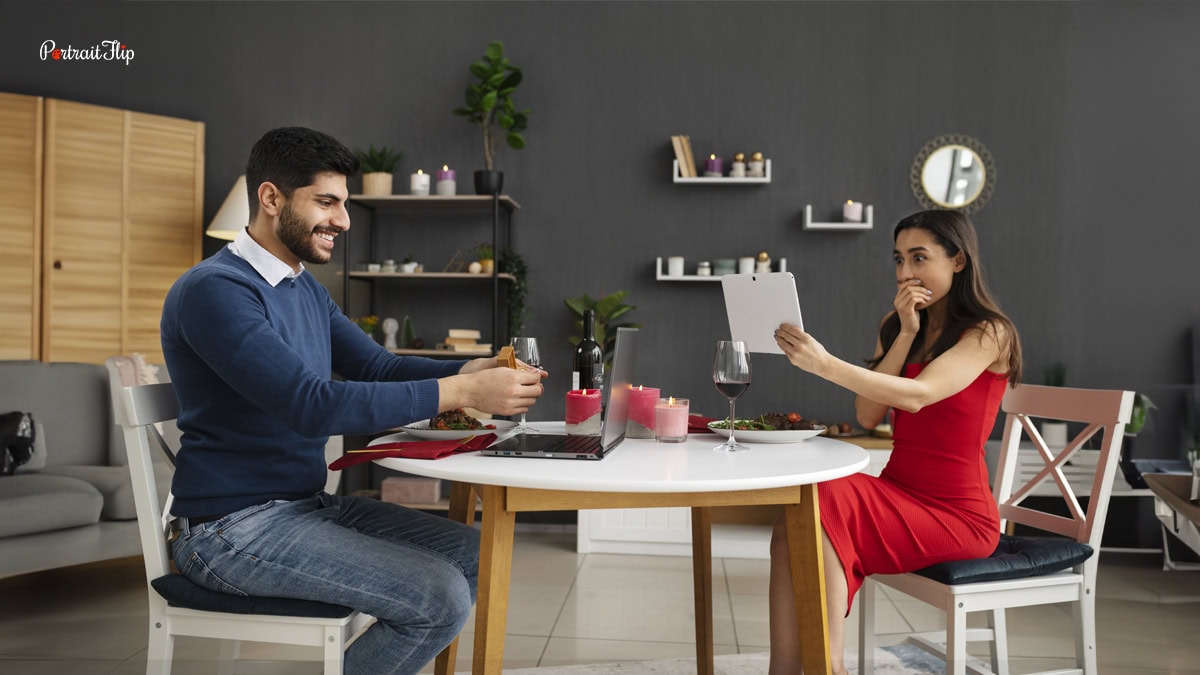 a couple siting across a table and planning