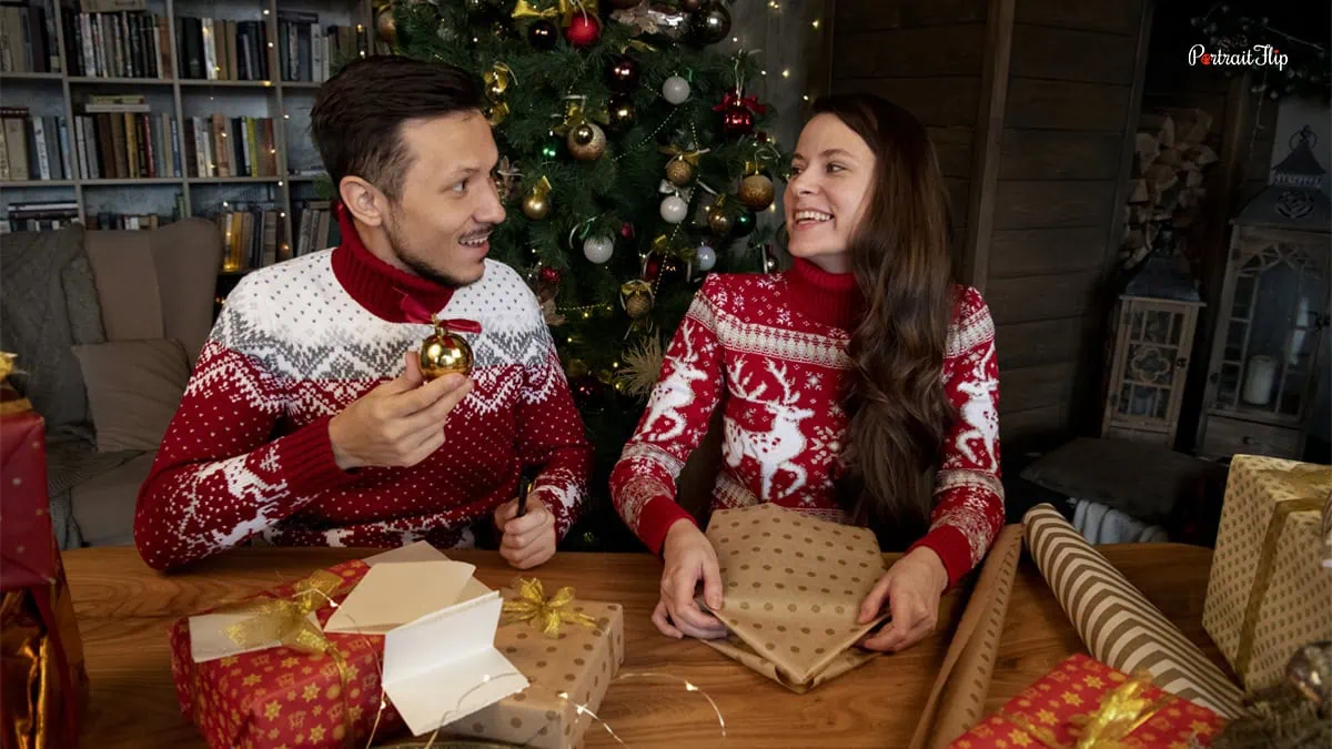 a couple wearing christmas sweaters