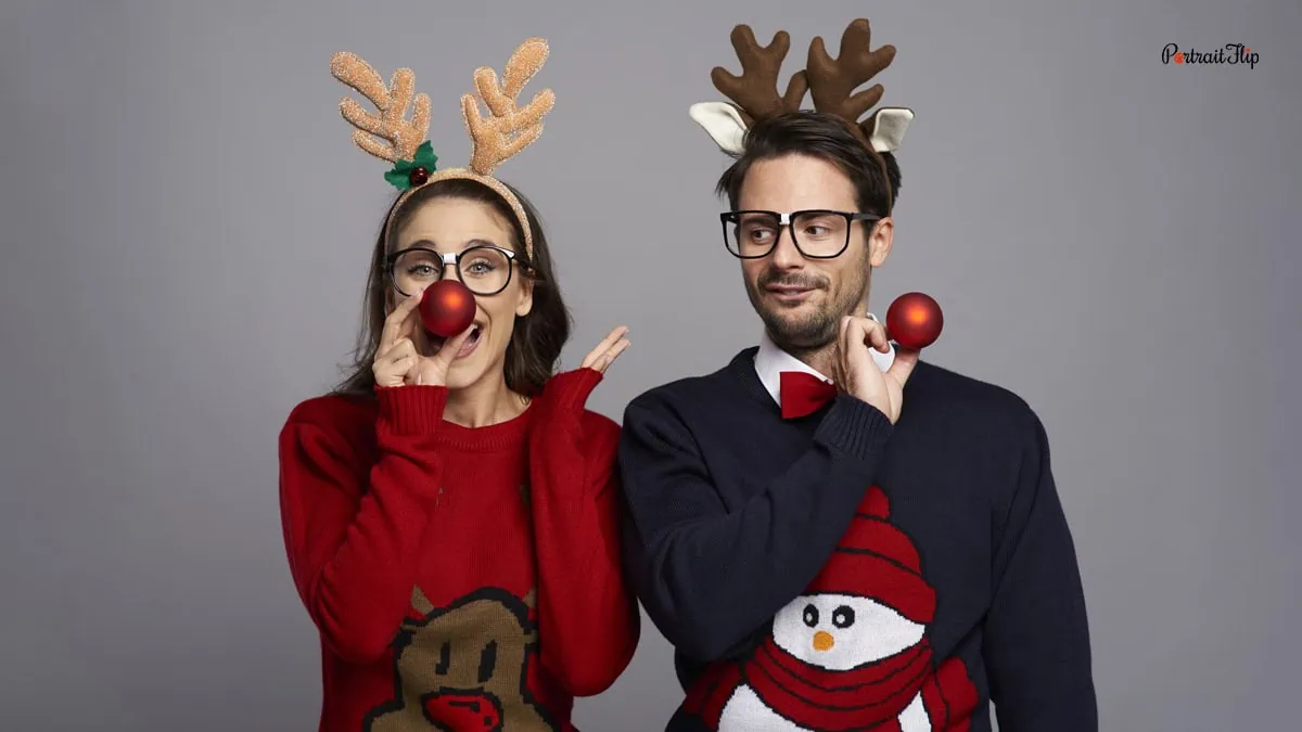 a couple using reindeer props