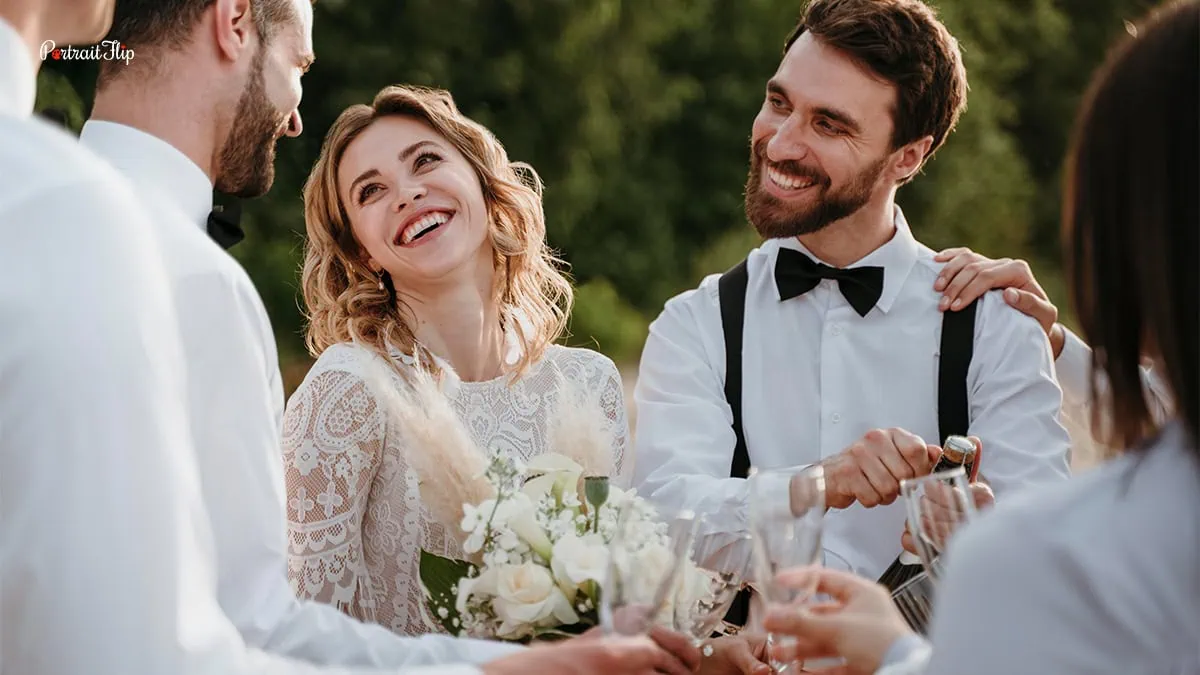 the bride and groom caught laughing in a candid moment