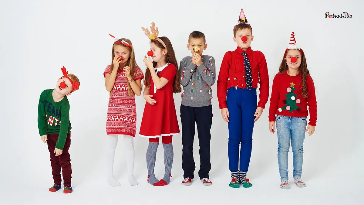 a group of children wearing christmas outfits