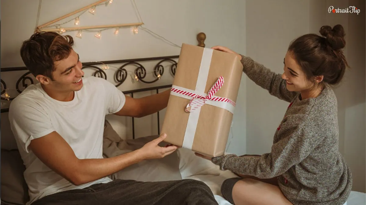 A girl giving gift to a boy